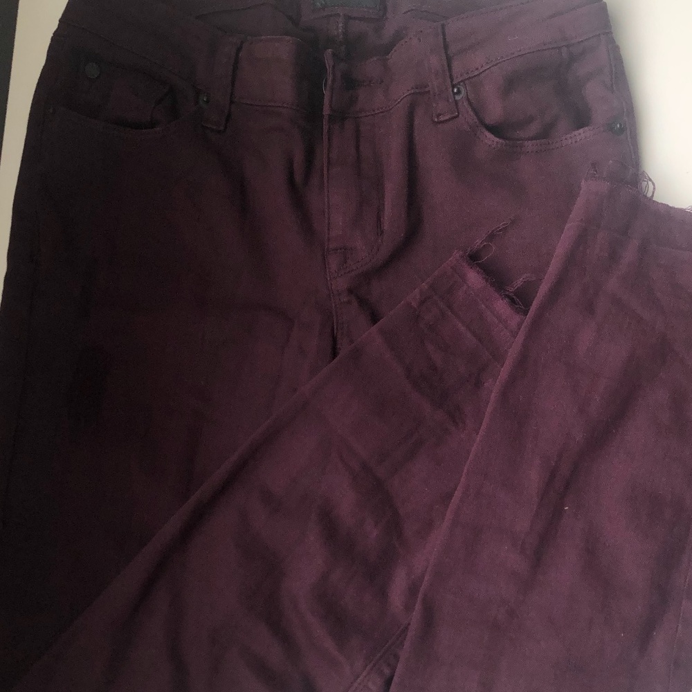 Distressed Hudson maroon jeans with raw hem